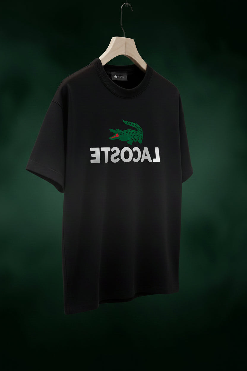 Black Lacoste t-shirt on a hanger in a stylish room.